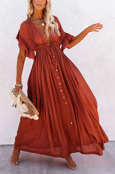 Vestido largo tipo murciélago con cintura con cordón y botones